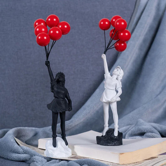 Skulptur eines Mädchen mit Ballon im Banksy-Stil für Tischdekoration und kreative Wohnzimmerdekoration